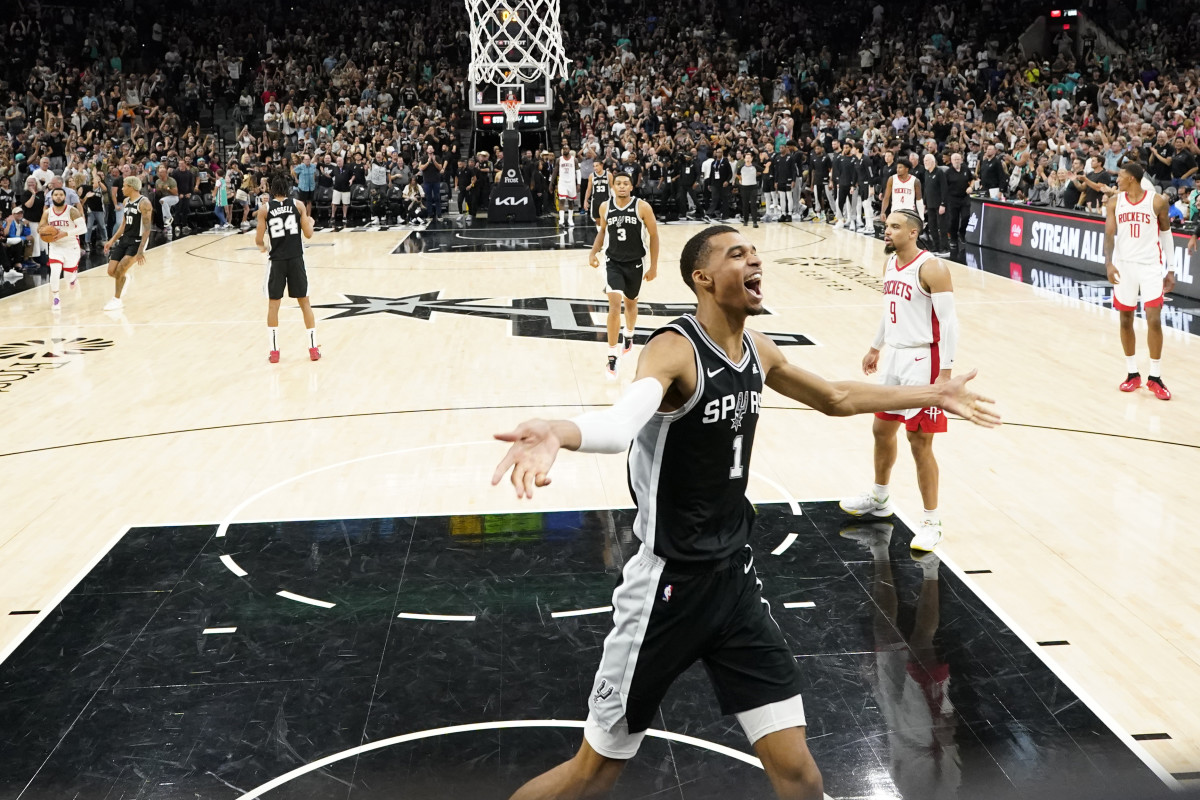 Oct 27, 2023; San Antonio, Texas, USA; San Antonio Spurs forward Victor Wembanyama (1) celebrates his first NBA victory after the Spurs defeated the Houston Rockets at Frost Bank Center.